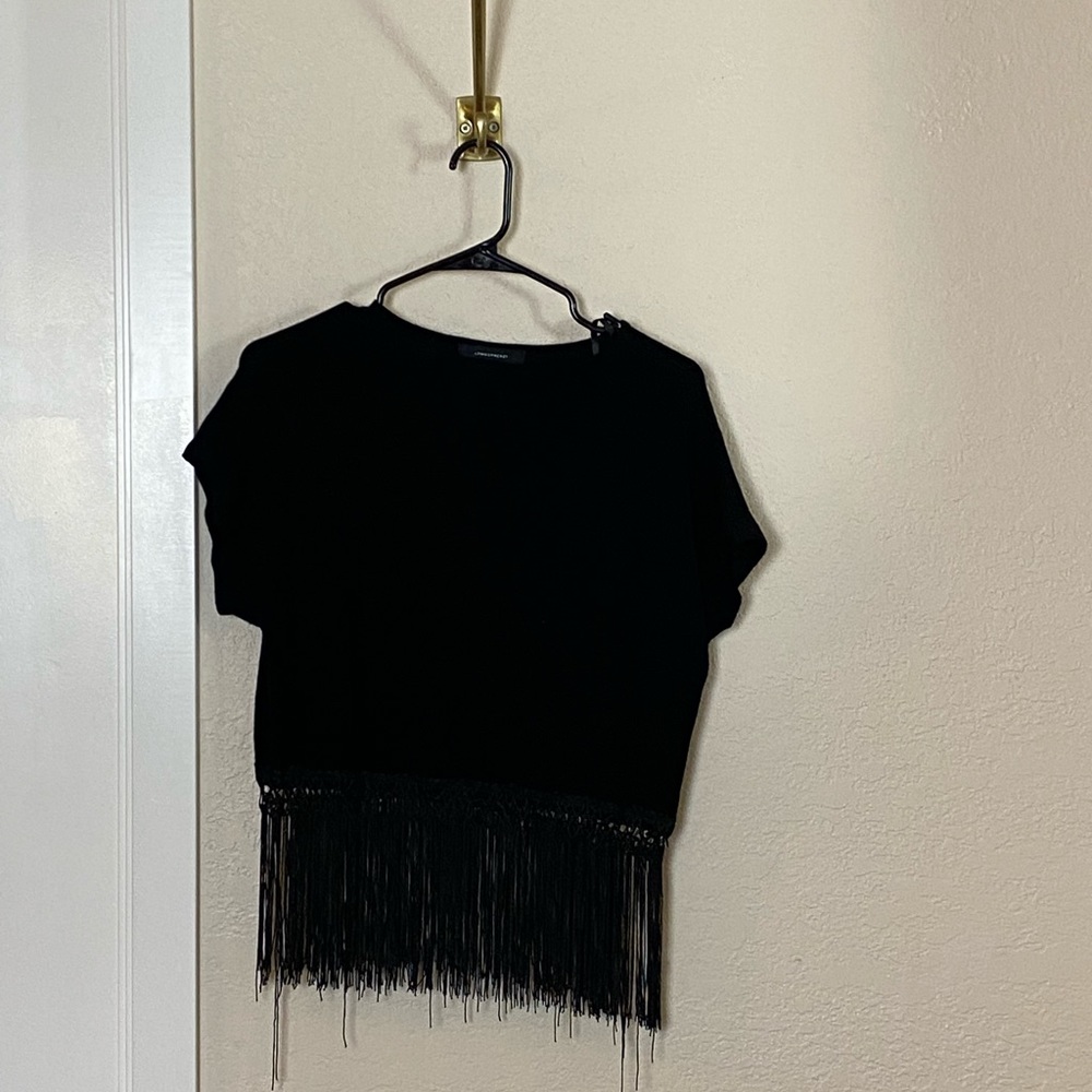 Black crop top with matching black fringe. Worn Ones. Good condition